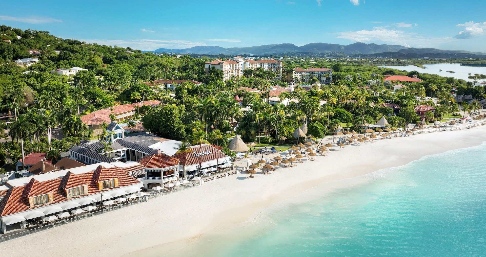 White-sand beach and turquoise water at Sandals Grande Antigua